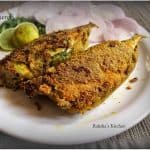 Close-up of coconut chutney stuffing inside mackerel, bharillo bangdo recipe