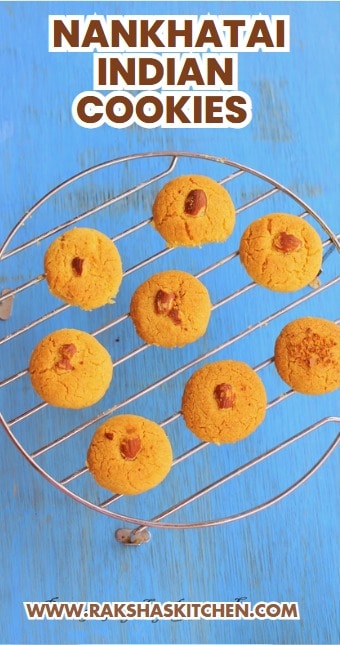 Freshly baked Indian shortbread cookies (Nankhatai) arranged in a rustic tray with chopped nuts.