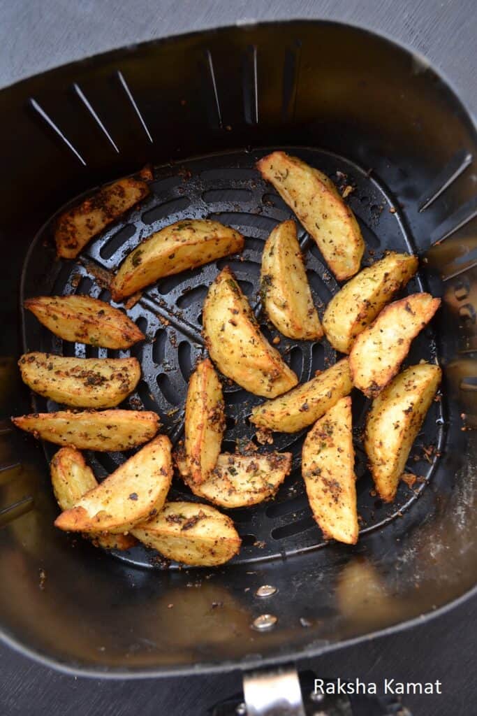 Air fryer potato wedges in air fryer basket