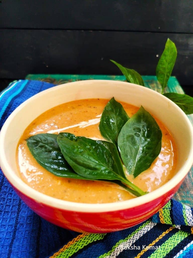 creamy tomato basil soup in a bowl