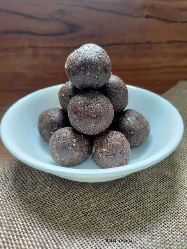 Rolling flaxseed energy balls with dates, coconut, and cardamom – easy no bake healthy snack