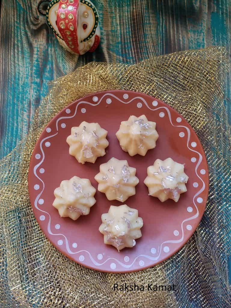 mava modak on clay plate with ganesha idol