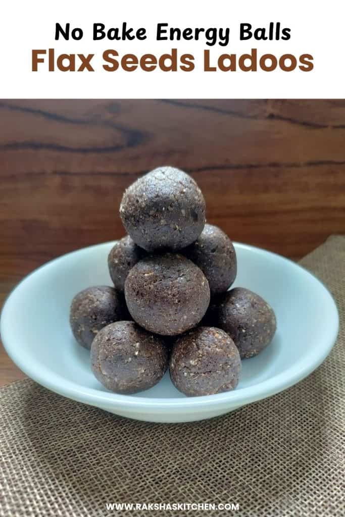 Flaxseed ladoos arranged on a plate with grated coconut sprinkled around.