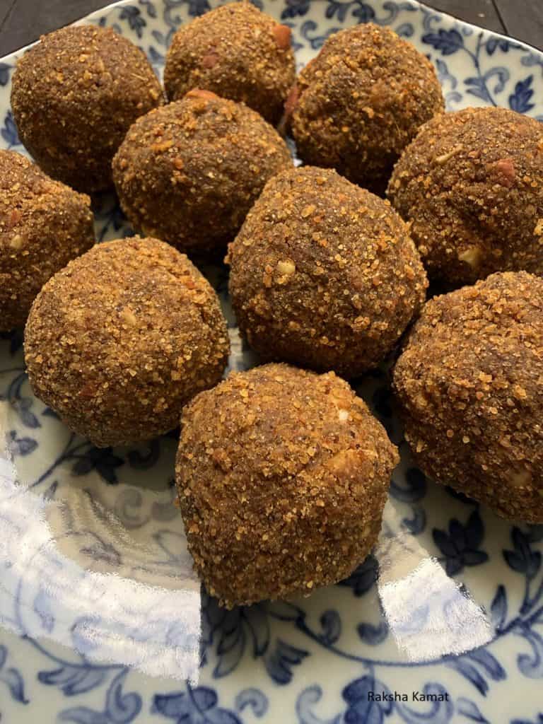 Whole moong being dry roasted in a pan until aromatic and golden for ladoo recipe